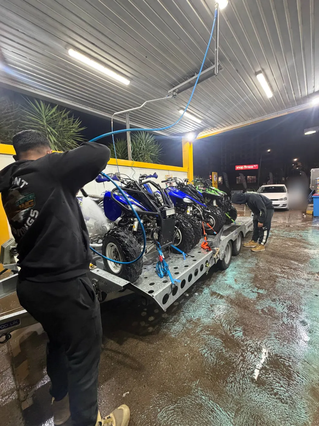 Four quad bikes strapped down on the FSF Hire CT177 tilt trailer